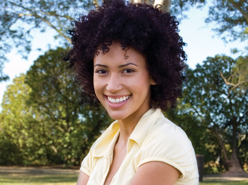 Woman in park-like setting smiling